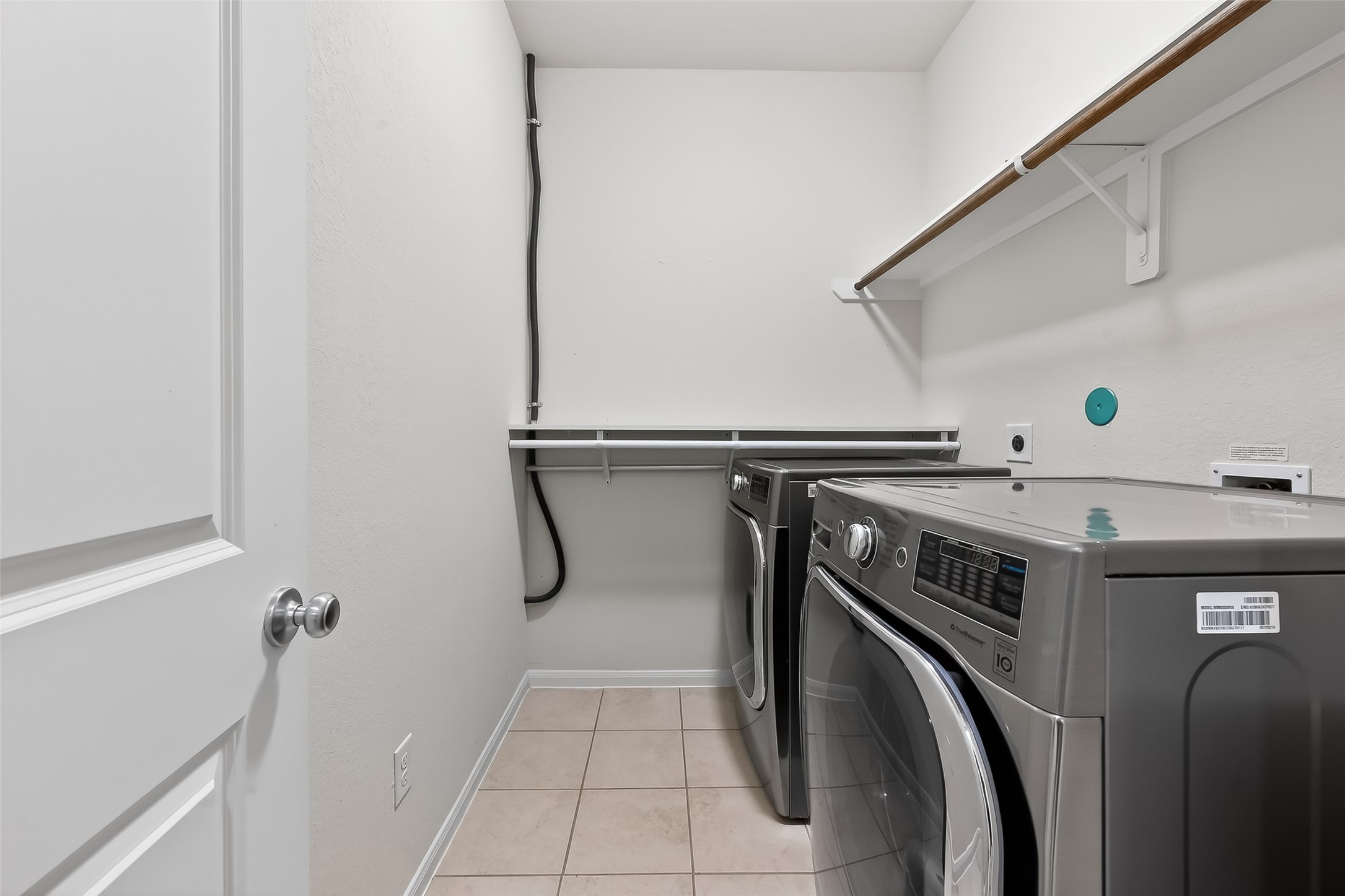 7631 Granite Terrace Lane Houston, TX 77083 - Photo 27 of 46 a utility room with dryer and washer