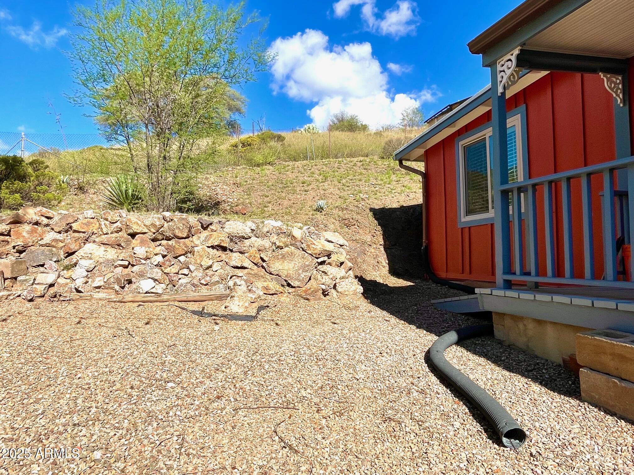 10 Locklin Avenue Bisbee, AZ 85603 - Photo 11 of 35 a view of a backyard with wooden fence
