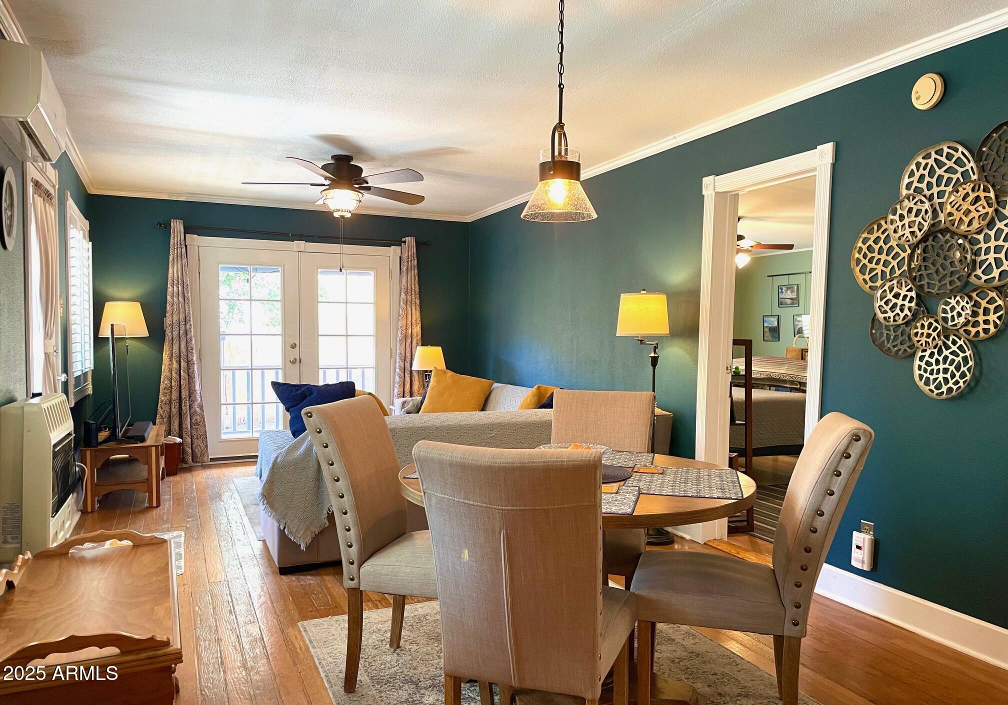 10 Locklin Avenue Bisbee, AZ 85603 - Photo 12 of 35 a view of a dining room with furniture and wooden floor