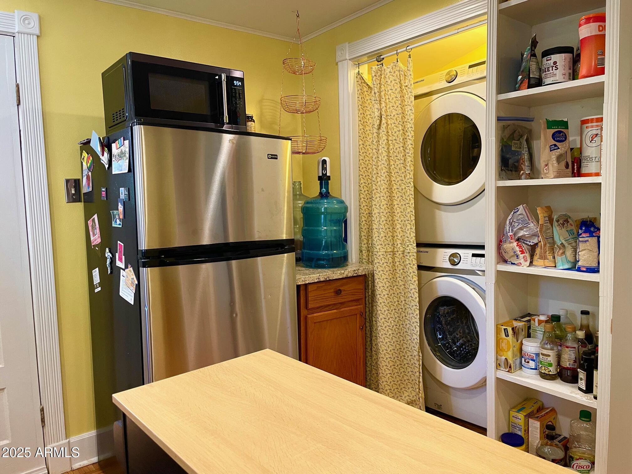 10 Locklin Avenue Bisbee, AZ 85603 - Photo 23 of 35 a kitchen with stainless steel appliances granite countertop a refrigerator and a stove top oven
