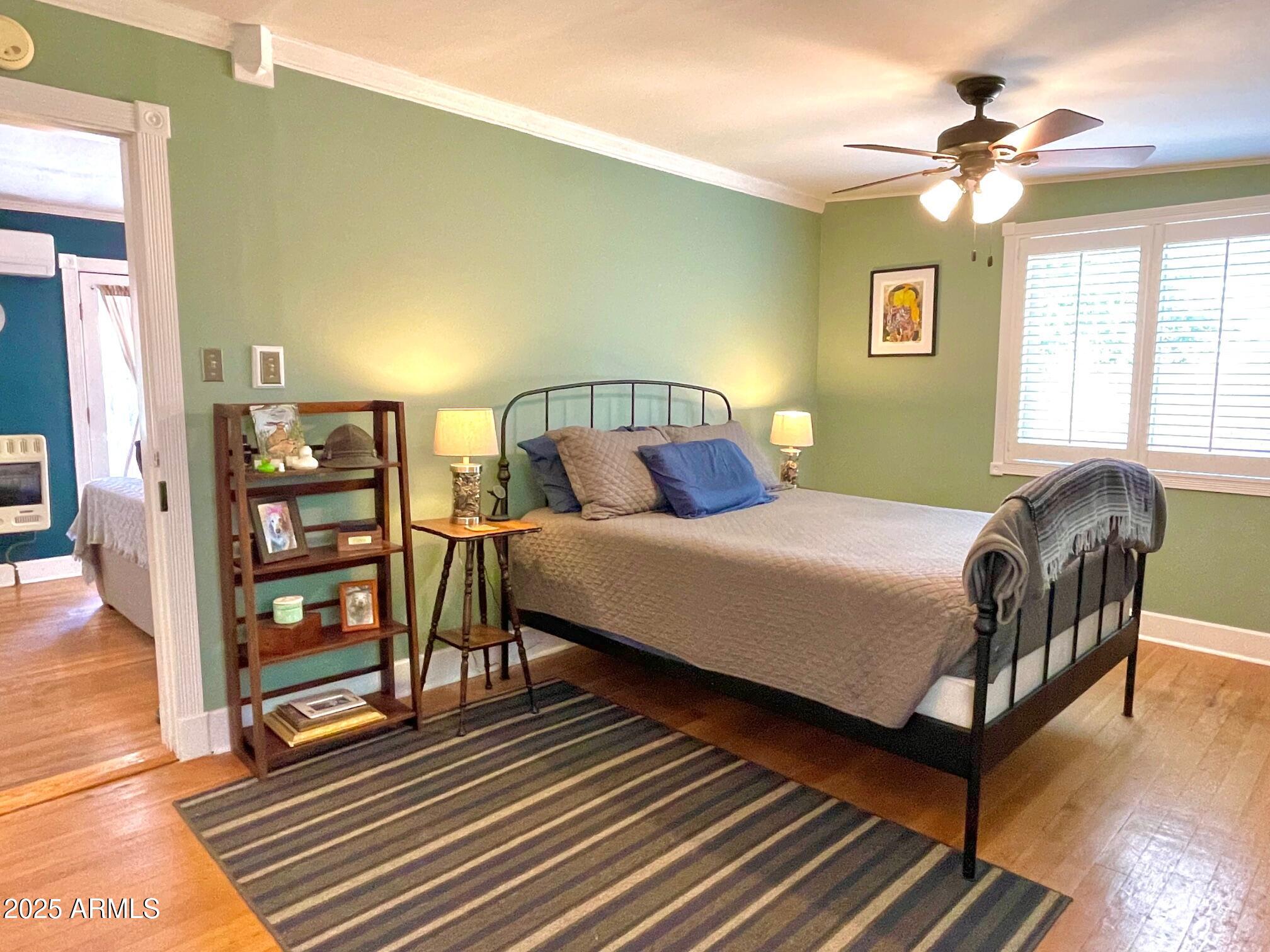 10 Locklin Avenue Bisbee, AZ 85603 - Photo 26 of 35 a bedroom with a bed furniture and a window