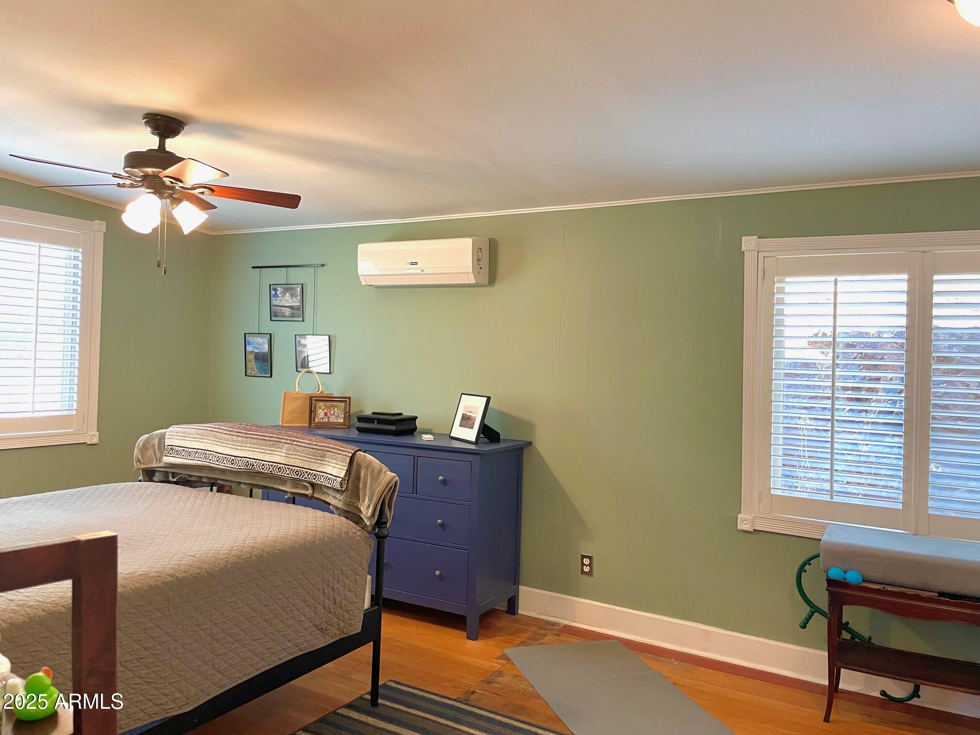 10 Locklin Avenue Bisbee, AZ 85603 - Photo 27 of 35 a bedroom with a bed and a window