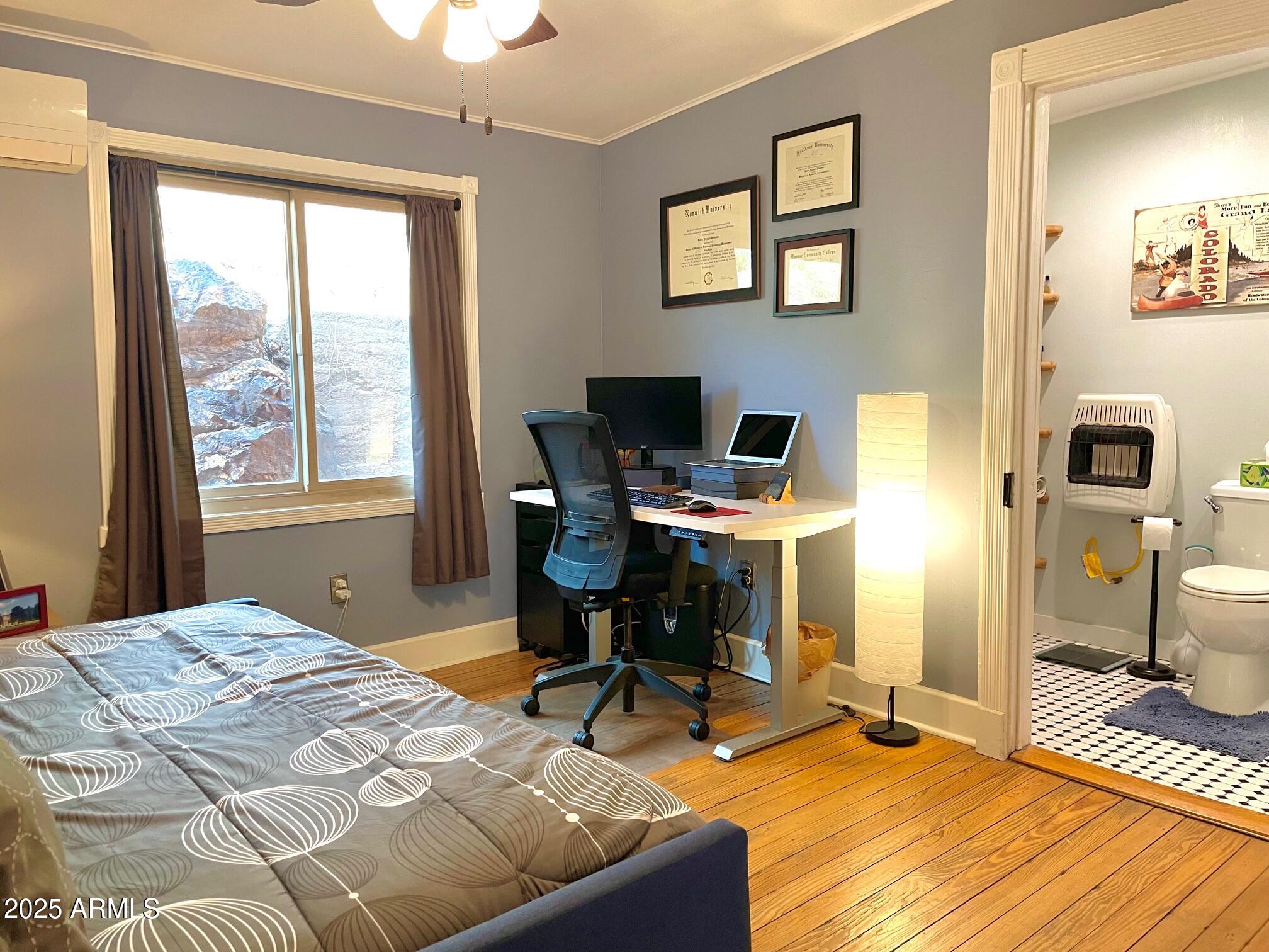 10 Locklin Avenue Bisbee, AZ 85603 - Photo 31 of 35 a bedroom with a bed and a window