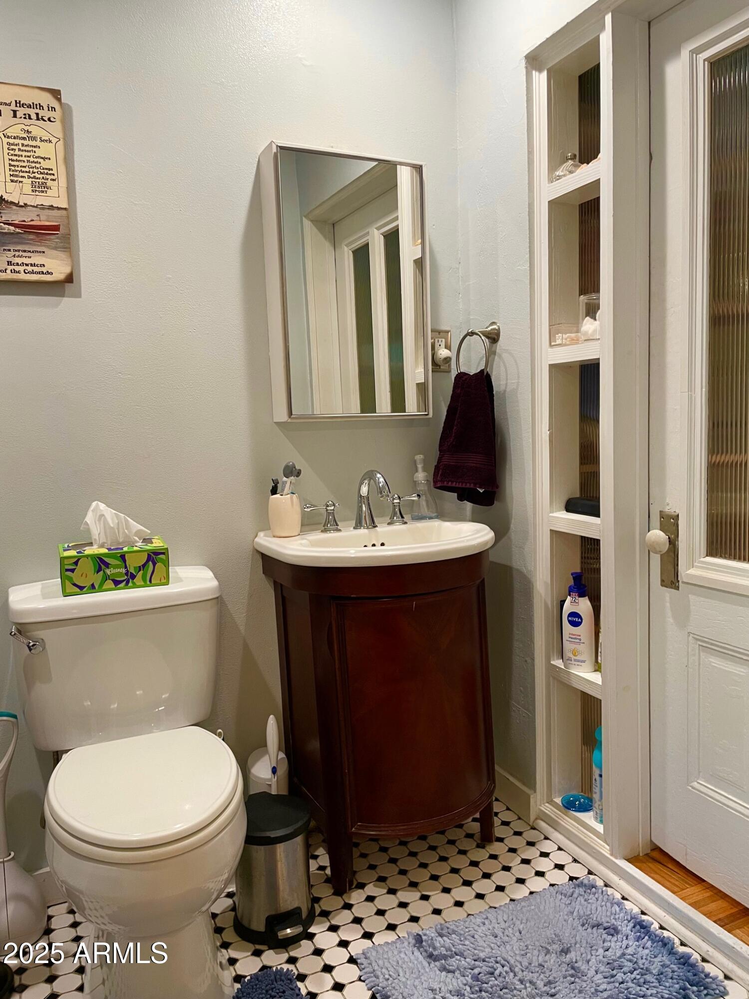 10 Locklin Avenue Bisbee, AZ 85603 - Photo 33 of 35 a bathroom with a sink and a toilet