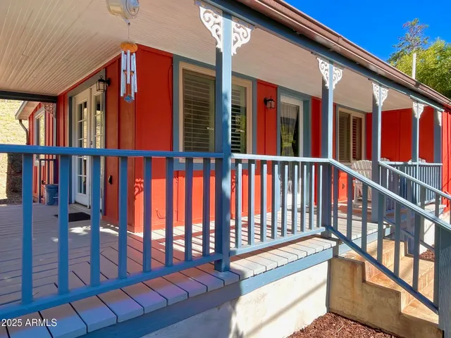 a view of a balcony with furniture