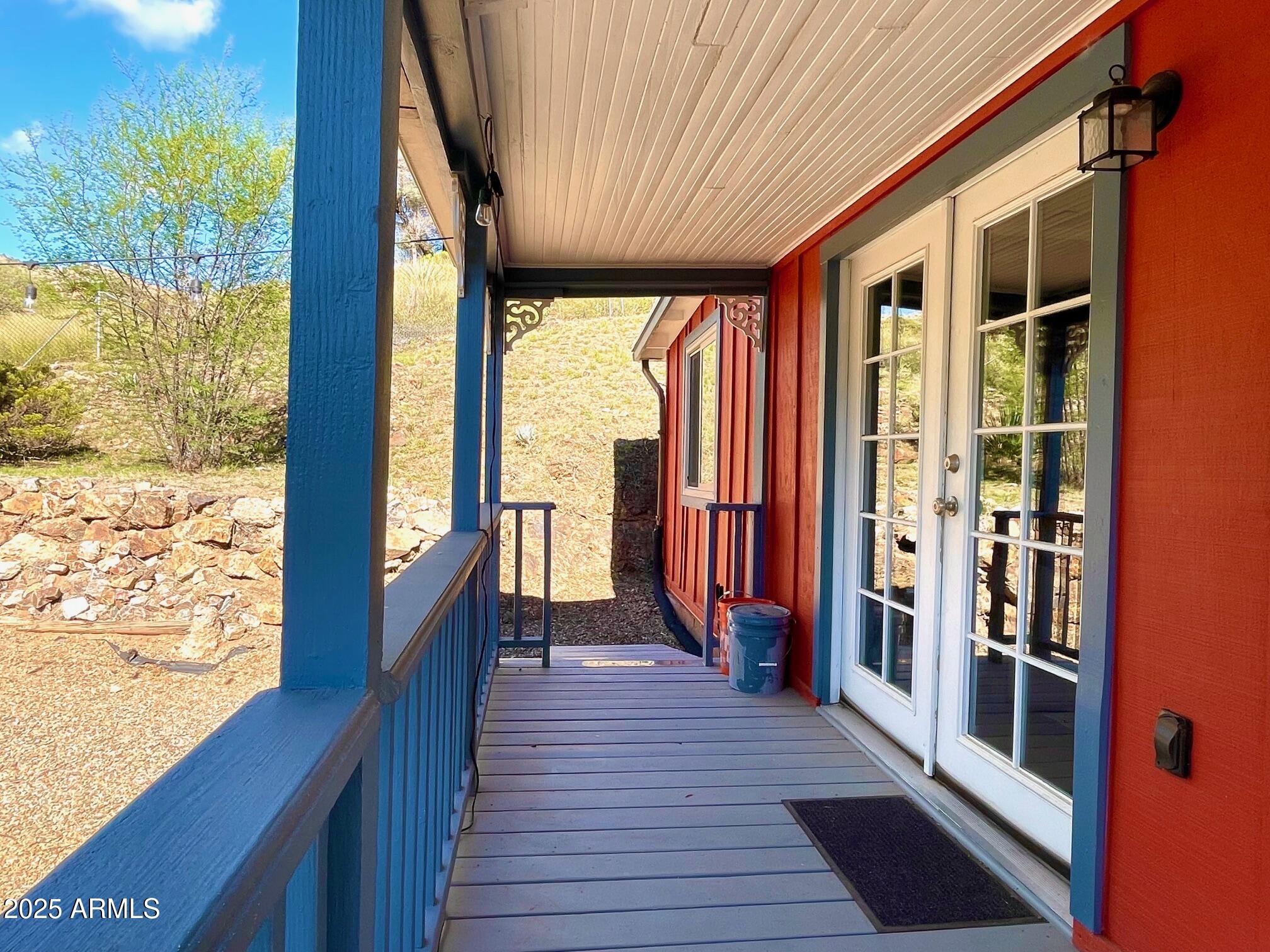 10 Locklin Avenue Bisbee, AZ 85603 - Photo 7 of 35 a view of a balcony with wooden floor and outdoor space