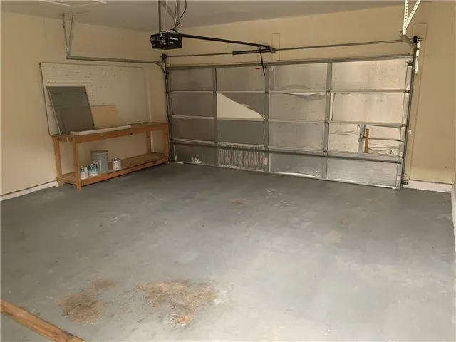 an empty room with a fireplace