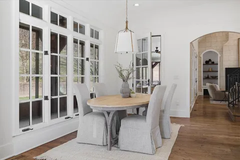 a view of an empty room with a window and a flat screen tv