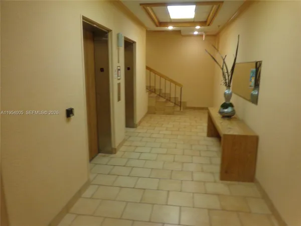 a view of a lake with chairs