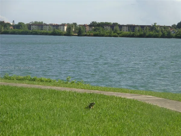 a view of a lake with a big yard