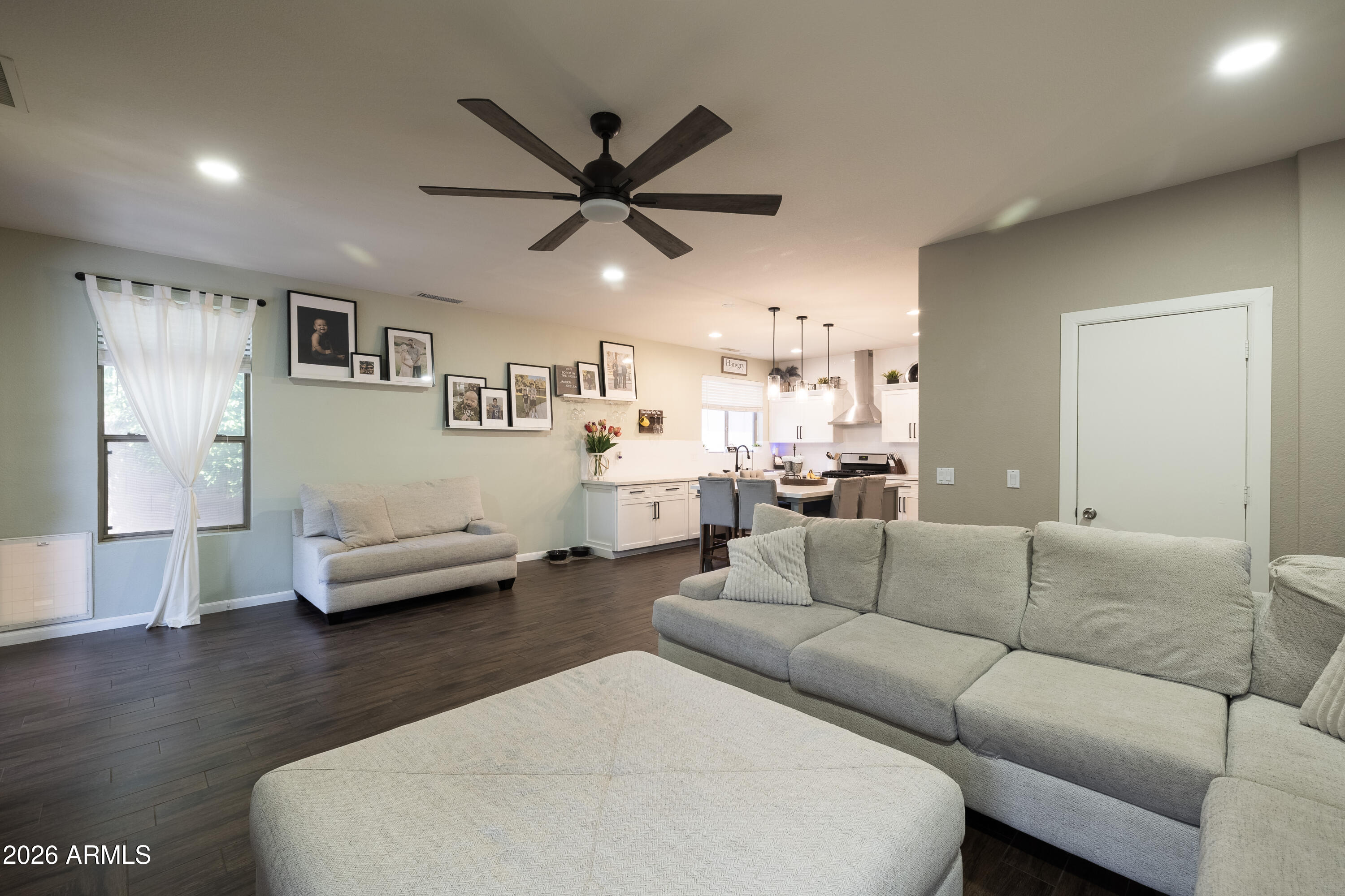 6407 West Saddlehorn Road Phoenix, AZ 85083 - Photo 21 of 41 a living room with furniture and a wooden floor