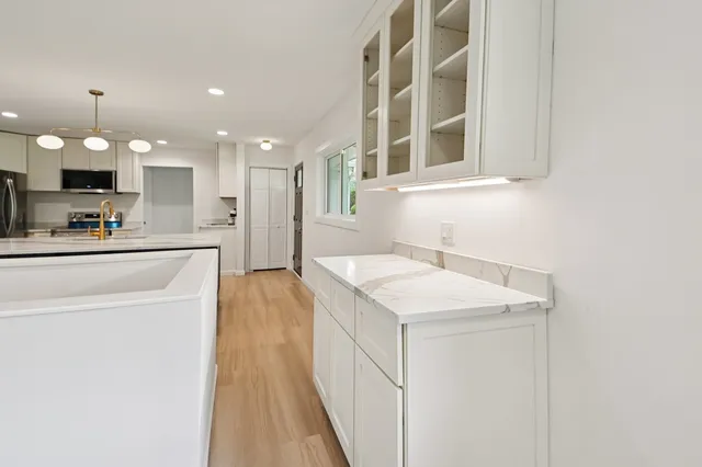 a kitchen with a sink and a refrigerator
