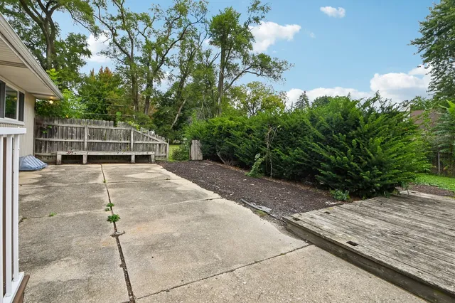 a backyard of a house with yard and outdoor seating