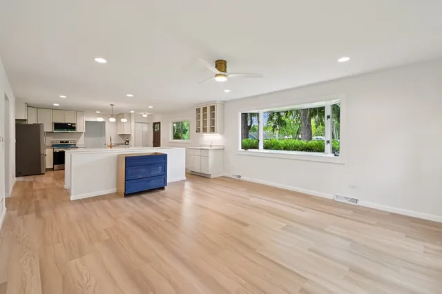 a view of kitchen with wooden floor and windows