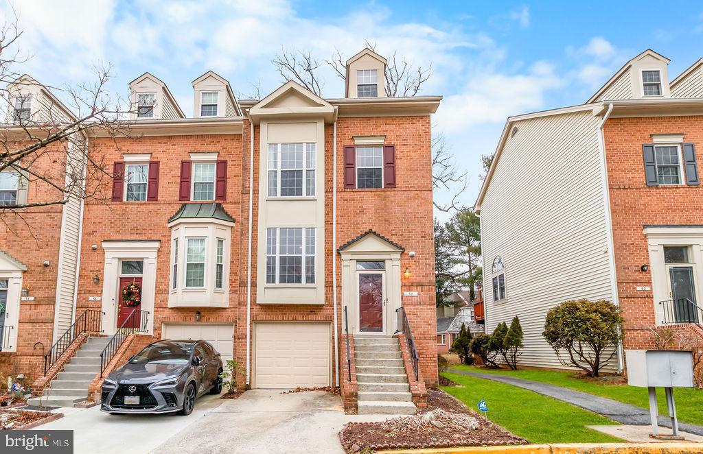a view of a car parked in front of a brick house