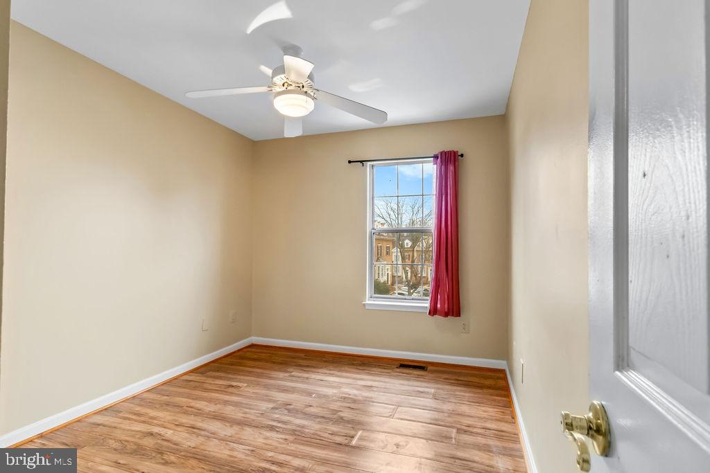 58 Silver Moon Drive Silver Spring, MD 20904 - Photo 21 of 34 a view of an empty room with wooden floor and a window
