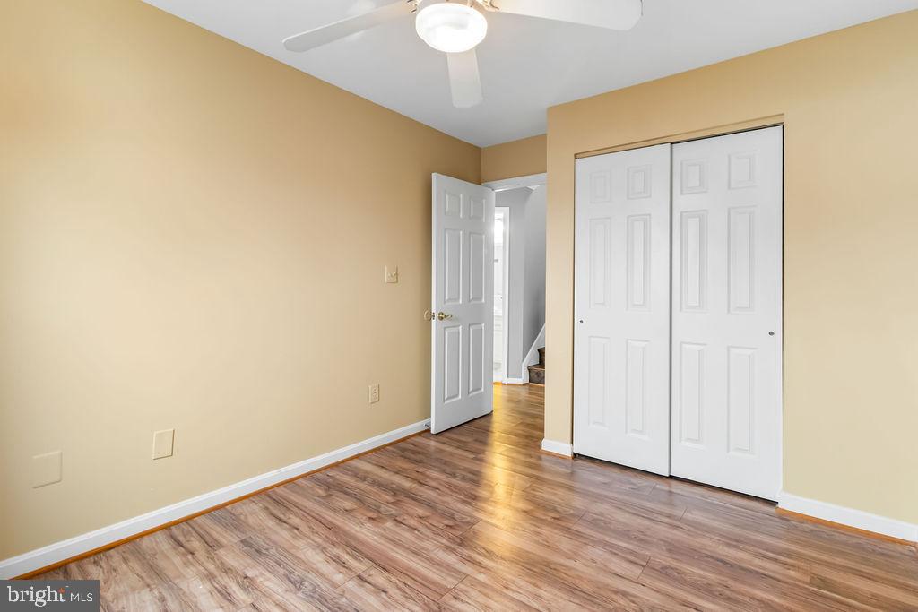 58 Silver Moon Drive Silver Spring, MD 20904 - Photo 22 of 34 a view of an empty room with wooden floor and a window
