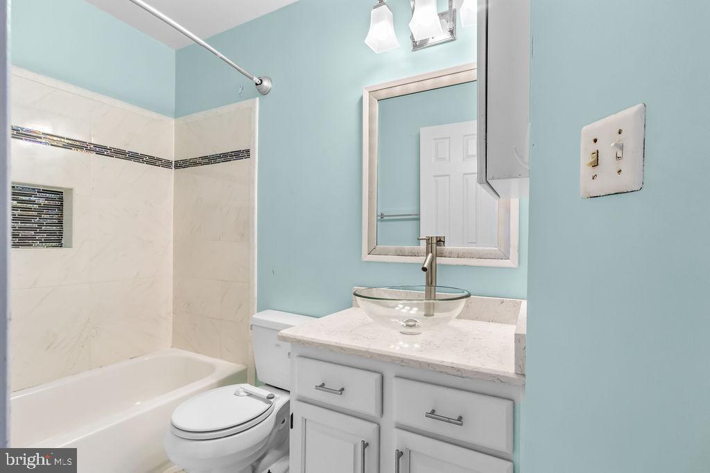 58 Silver Moon Drive Silver Spring, MD 20904 - Photo 26 of 34 a bathroom with a sink a toilet and shower