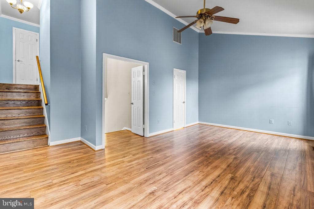 58 Silver Moon Drive Silver Spring, MD 20904 - Photo 27 of 34 a view of a livingroom with wooden floor and a ceiling fan
