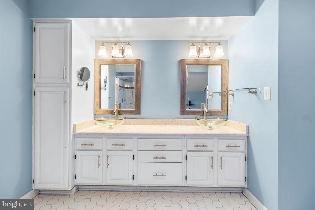 58 Silver Moon Drive Silver Spring, MD 20904 - Photo 34 of 34 a bathroom with a double vanity sink and a mirror