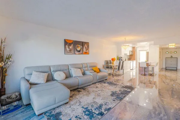 a living room with furniture and a table