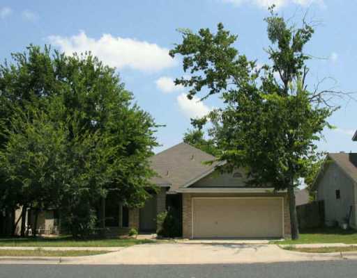 5402 Teri Road Austin, TX 78744 - Photo 1 of 1 a view of a house with a yard and garage