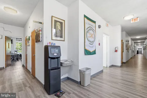 a view of entryway livingroom and hallway with wooden floor