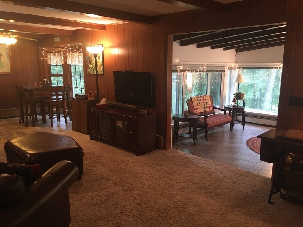18 Butternut Drive Sutton, MA 01590 - Photo 18 of 34 a living room with furniture and a flat screen tv