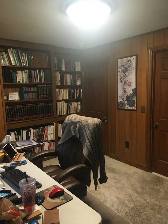 18 Butternut Drive Sutton, MA 01590 - Photo 24 of 34 a bedroom with a bed a book shelf and a window