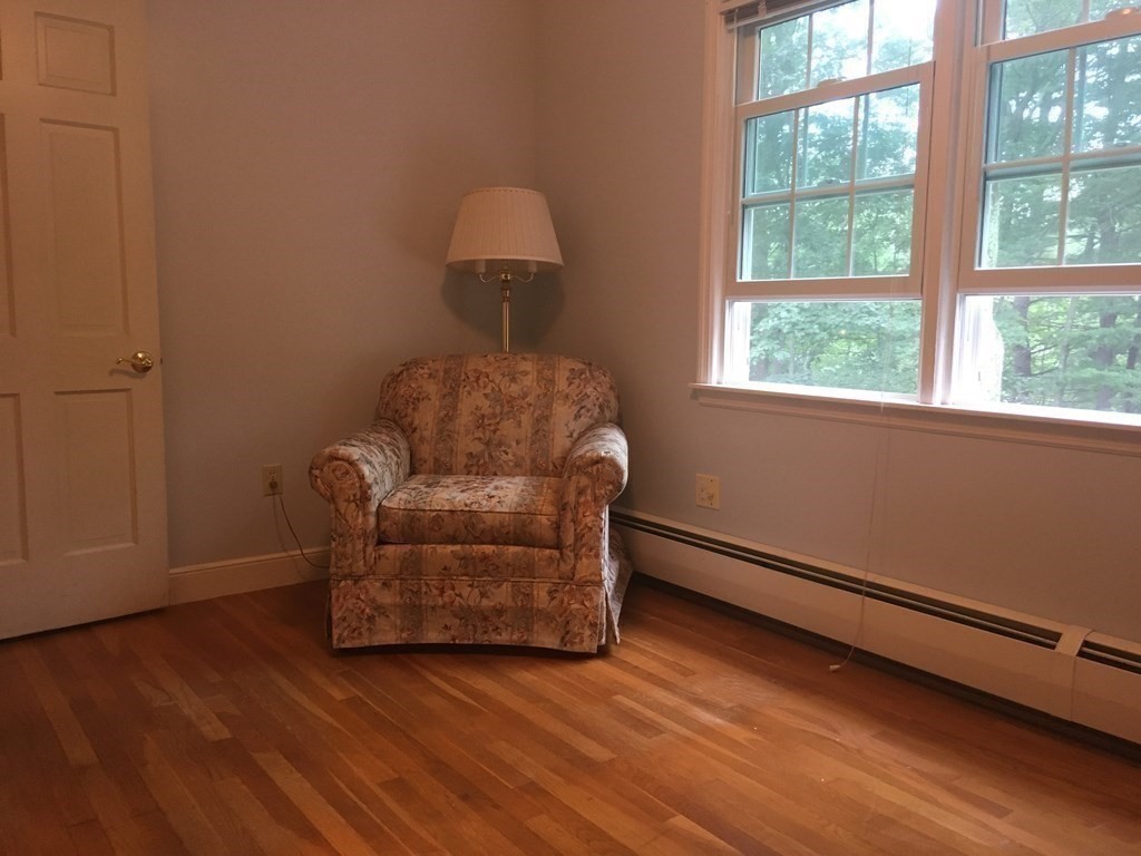 18 Butternut Drive Sutton, MA 01590 - Photo 28 of 34 a living room with furniture and a window