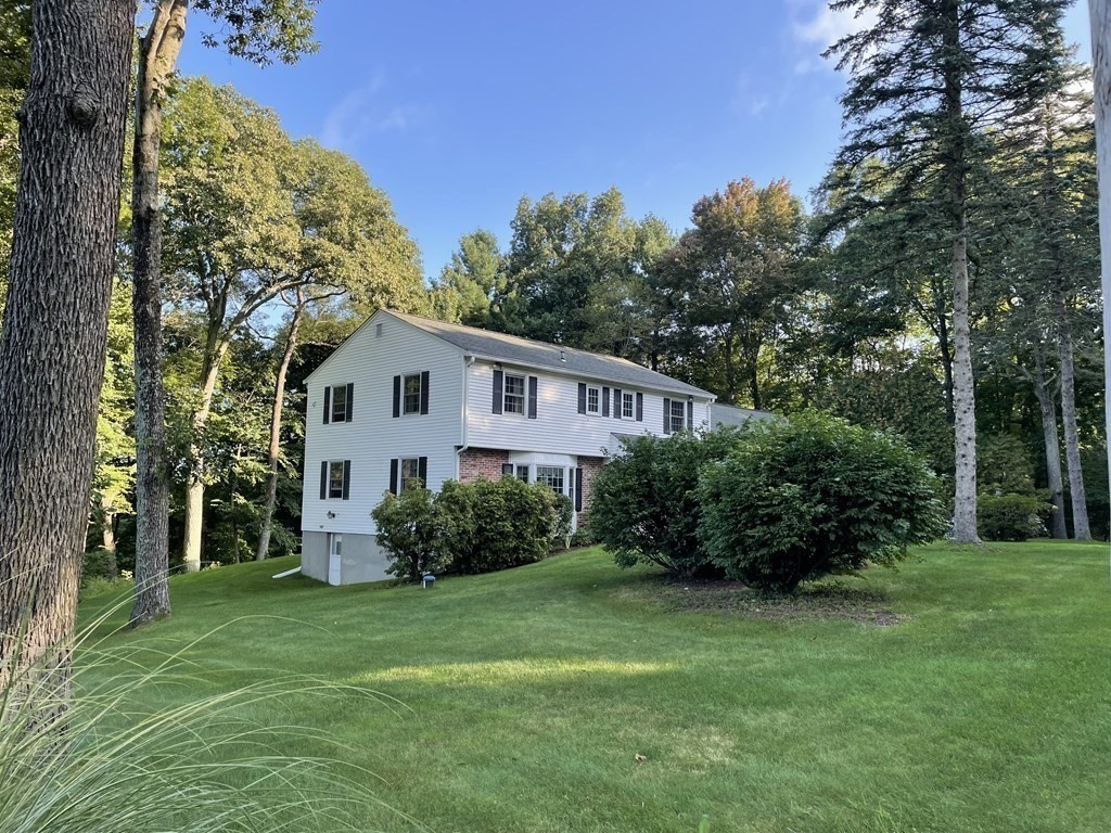 18 Butternut Drive Sutton, MA 01590 - Photo 3 of 34 a house view with a garden space