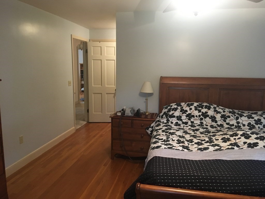 18 Butternut Drive Sutton, MA 01590 - Photo 33 of 34 a bed sitting in a bedroom next to a window