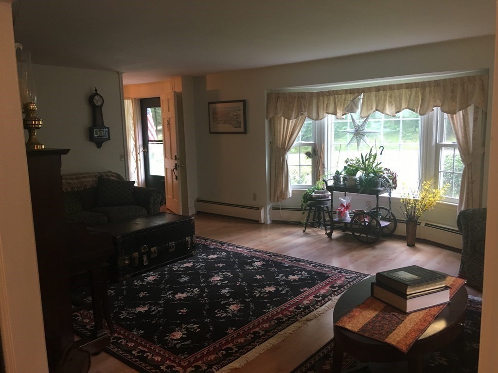 18 Butternut Drive Sutton, MA 01590 - Photo 6 of 34 a living room with furniture and a window