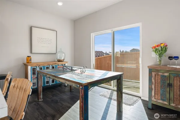 a bathroom with a sink mirror and a toilet