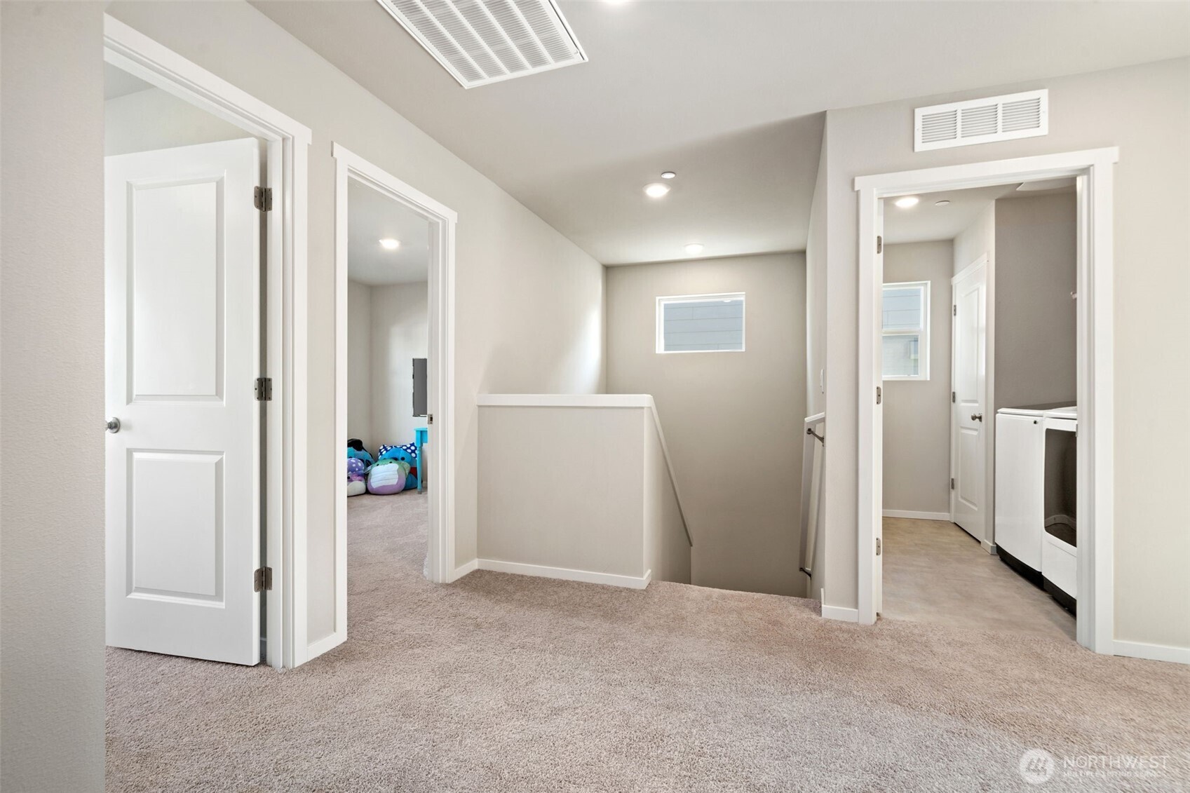 949 Tetherow Street Bremerton, WA 98310 - Photo 16 of 35 an empty room with windows and wooden door