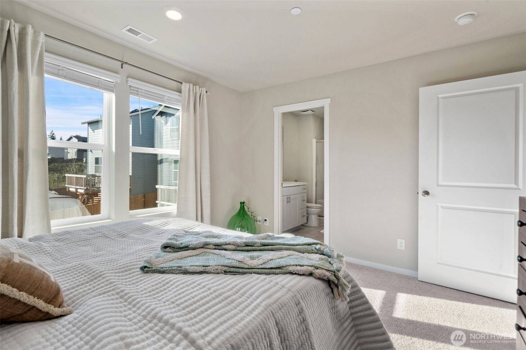 949 Tetherow Street Bremerton, WA 98310 - Photo 19 of 35 a bedroom with a bed and a large mirror