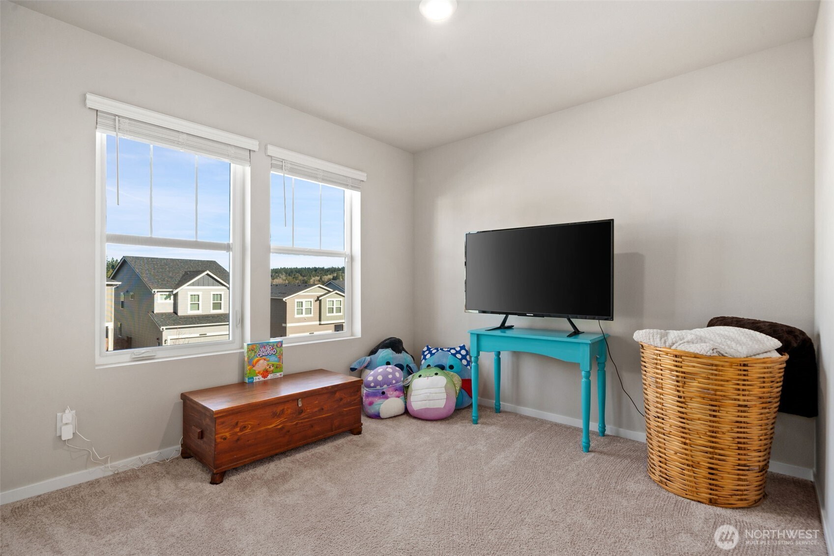 949 Tetherow Street Bremerton, WA 98310 - Photo 24 of 35 a room with furniture and a flat screen tv