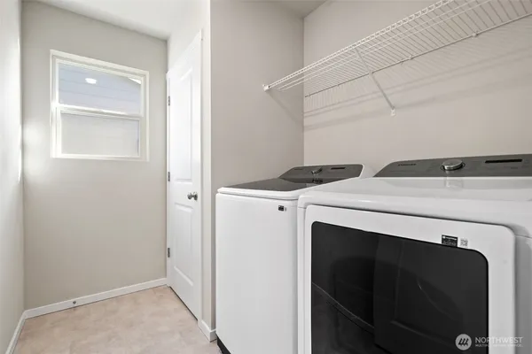 a view of a patio with table and chairs and potted plants