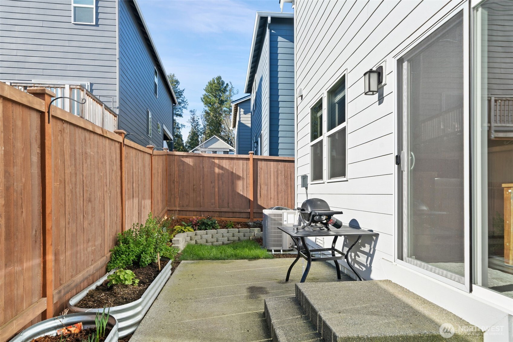949 Tetherow Street Bremerton, WA 98310 - Photo 28 of 35 a view of a patio with table and chairs and potted plants