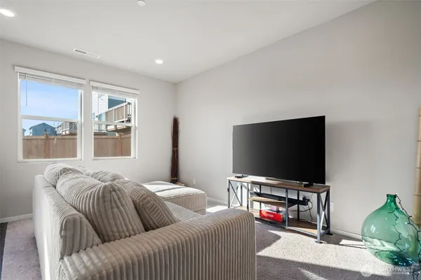 a kitchen with a sink appliances and cabinets