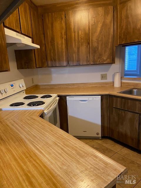 1565 Parkway Drive Rohnert Park, CA 94928 - Photo 13 of 25 a kitchen with stainless steel appliances a stove a microwave a sink and cabinets