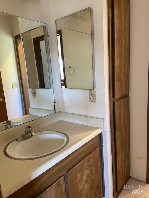 1565 Parkway Drive Rohnert Park, CA 94928 - Photo 19 of 25 a bathroom with a sink and a mirror
