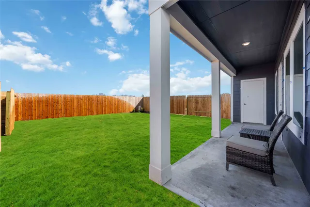 a view of yard with patio