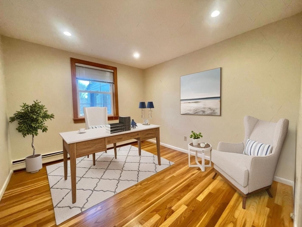 77 Louise Road, Unit 77 Newton, MA 02467 - Photo 11 of 22 a room with furniture and a wooden floor