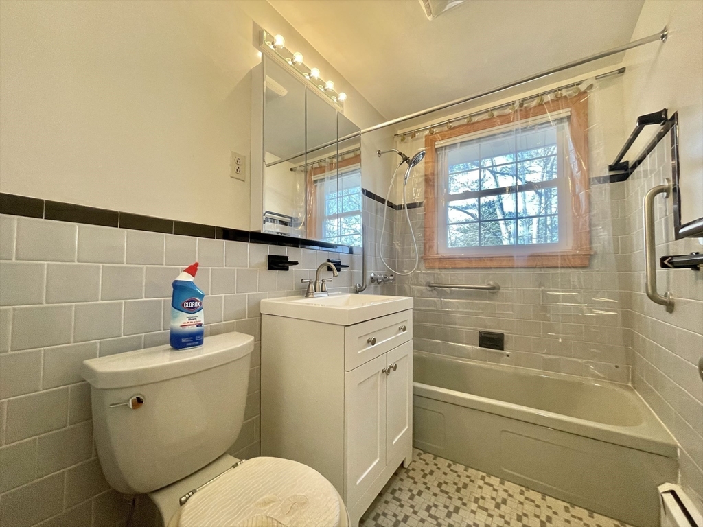 77 Louise Road, Unit 77 Newton, MA 02467 - Photo 15 of 22 a bathroom with a sink a toilet and shower