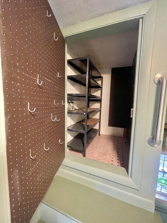 77 Louise Road, Unit 77 Newton, MA 02467 - Photo 17 of 22 a view of staircase with white walls and a rug