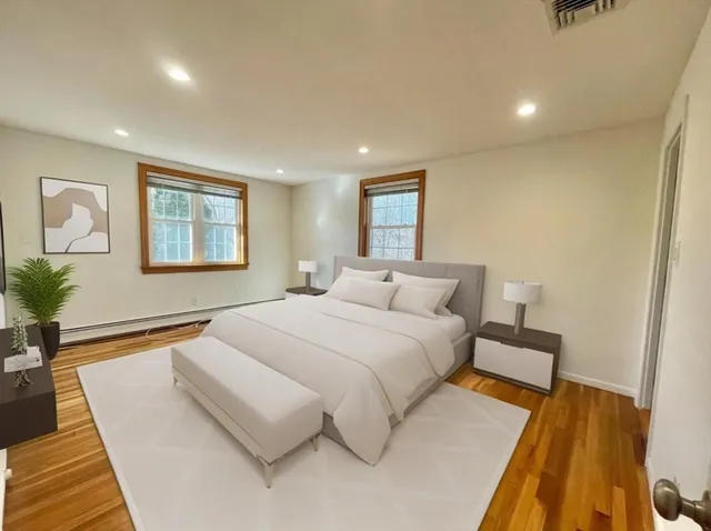 a bedroom with a bed and a couch