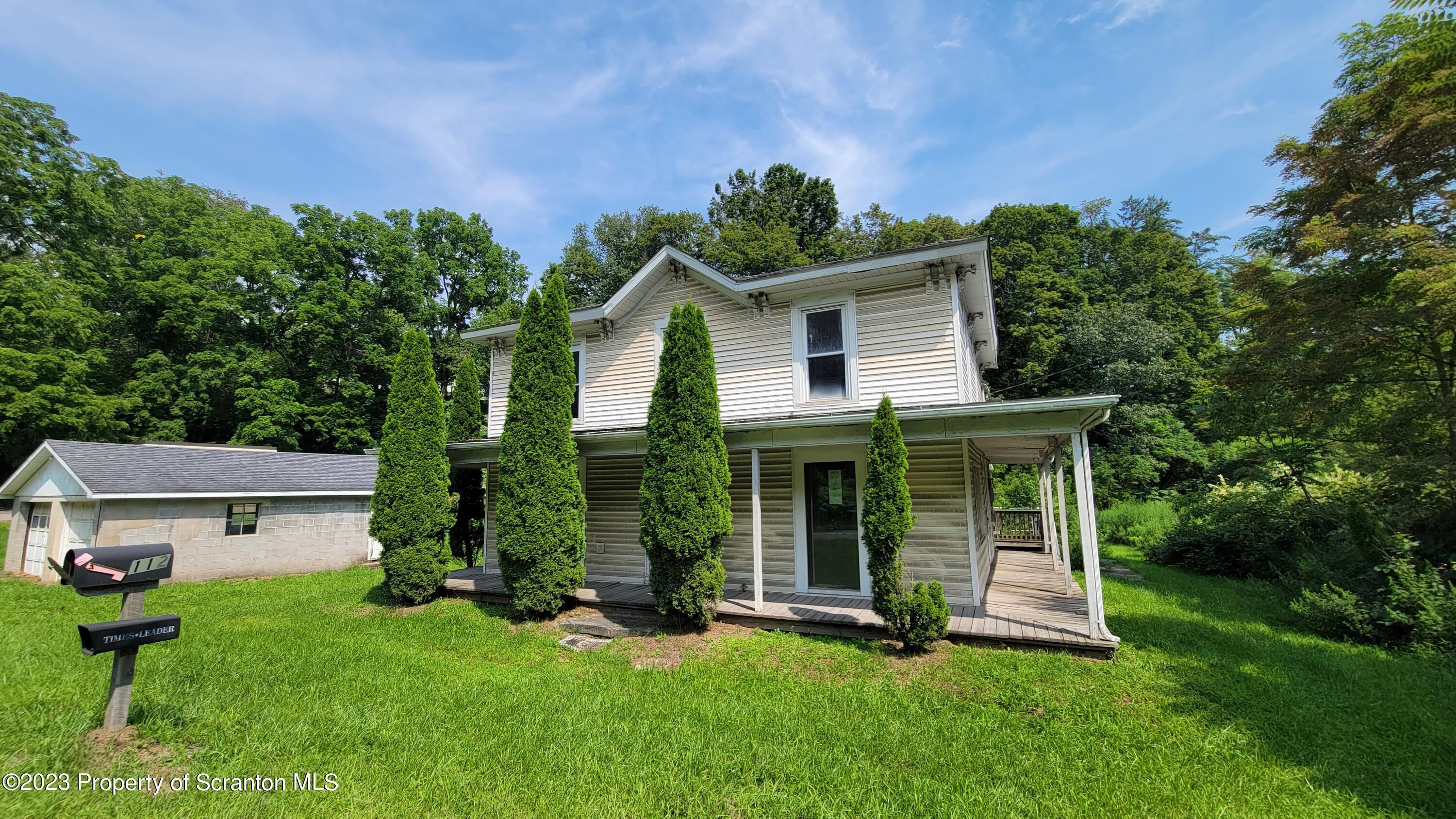 112 Mowry Road Meshoppen, PA 18630 - Photo 1 of 24 front view of a house with a yard