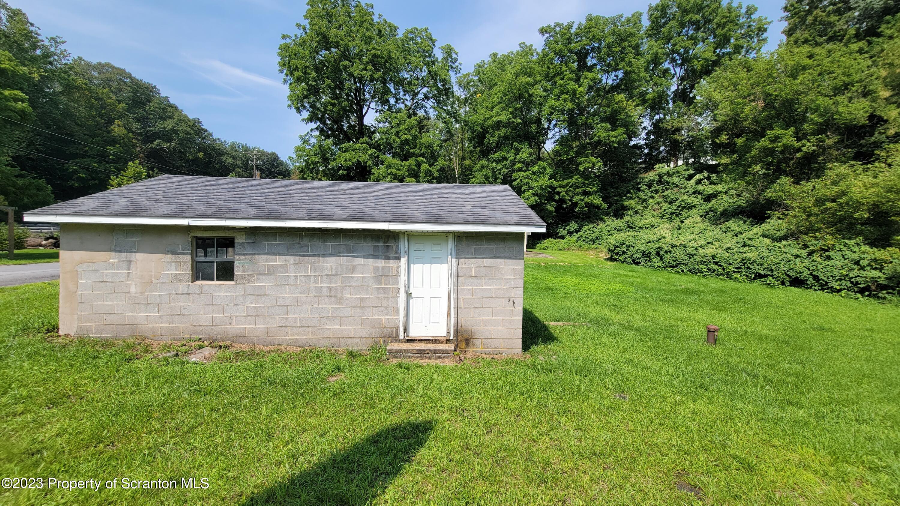 112 Mowry Road Meshoppen, PA 18630 - Photo 19 of 24 a aerial view of a house with a yard and garage