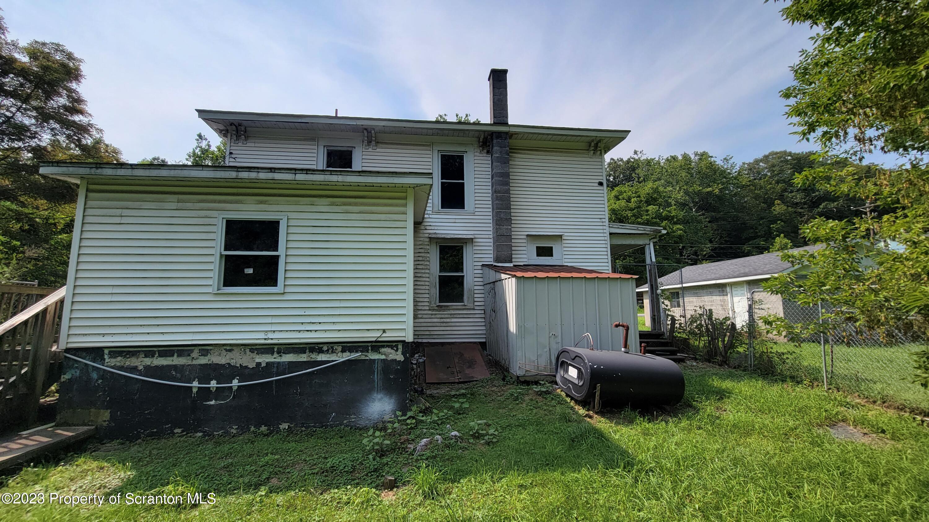 112 Mowry Road Meshoppen, PA 18630 - Photo 2 of 24 a backyard of a house with table and chairs